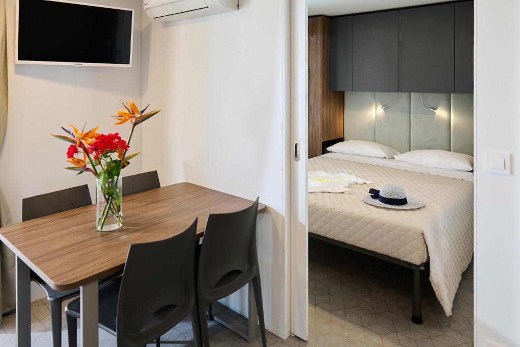 Postel nebo postele na pokoji v ubytování Camping Villaggio Calypso