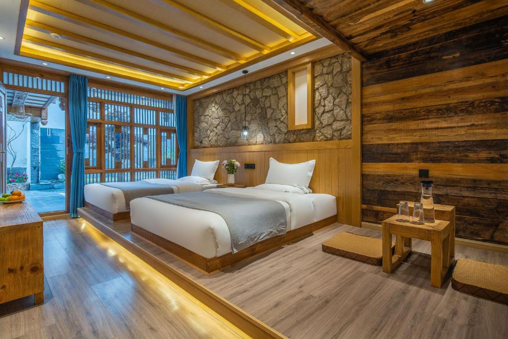 Postel nebo postele na pokoji v ubytování 夕露古城中心店 XILU INN NANXI - Ancient City Center Branch