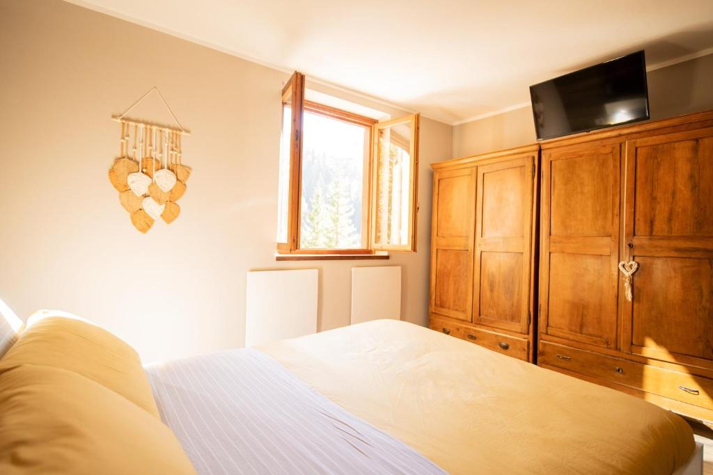 Postel nebo postele na pokoji v ubytování Maison Foppolo A due passi dalla Funivia