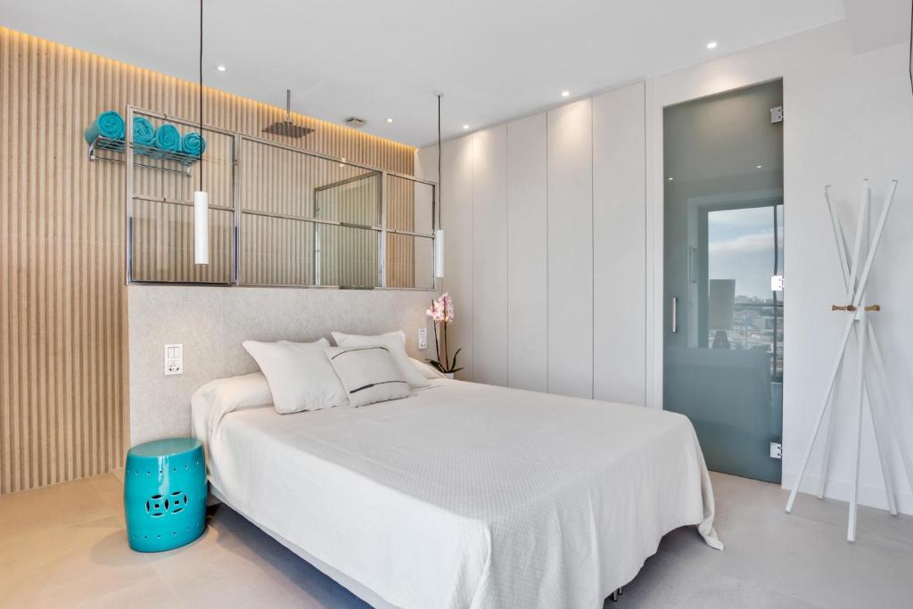 Łóżko lub łóżka w pokoju w obiekcie Exclusivo apartamento con increíbles vistas al mar