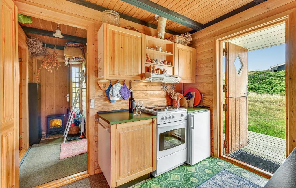 Kuchyň nebo kuchyňský kout v ubytování Hoejris Hus