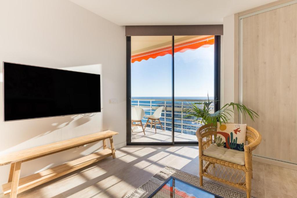 TV a/nebo společenská místnost v ubytování Fabuloso apartamento con increíbles vistas al mar