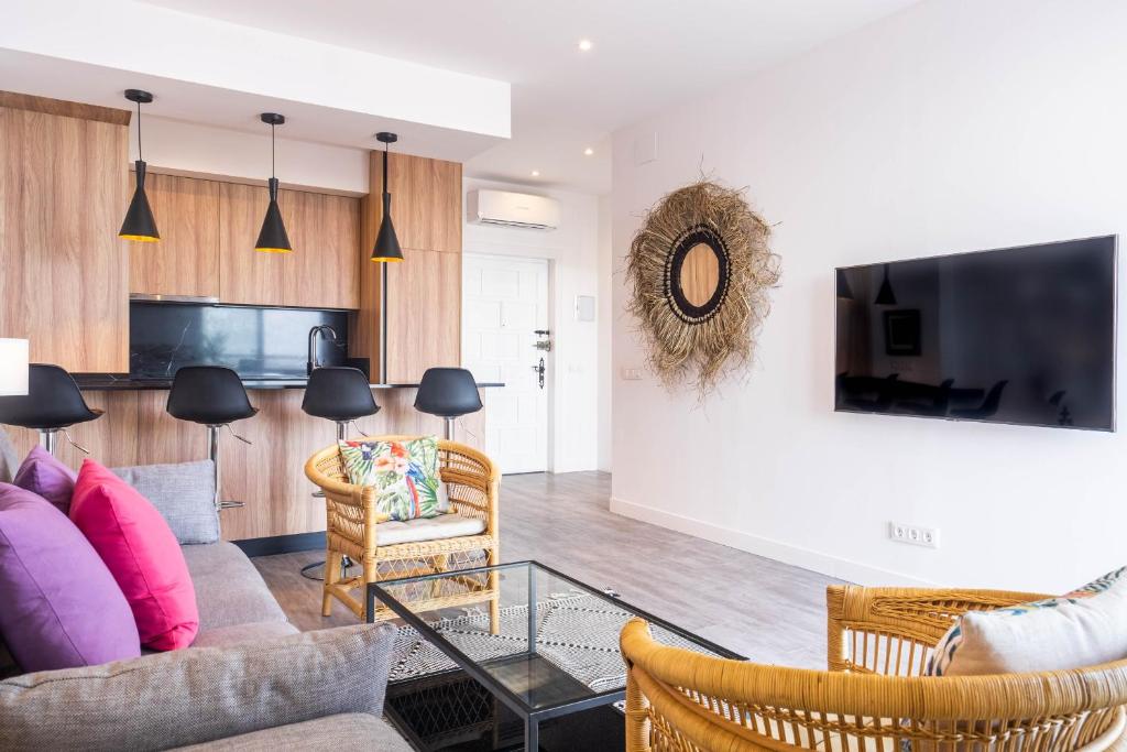 TV a/nebo společenská místnost v ubytování Fabuloso apartamento con increíbles vistas al mar