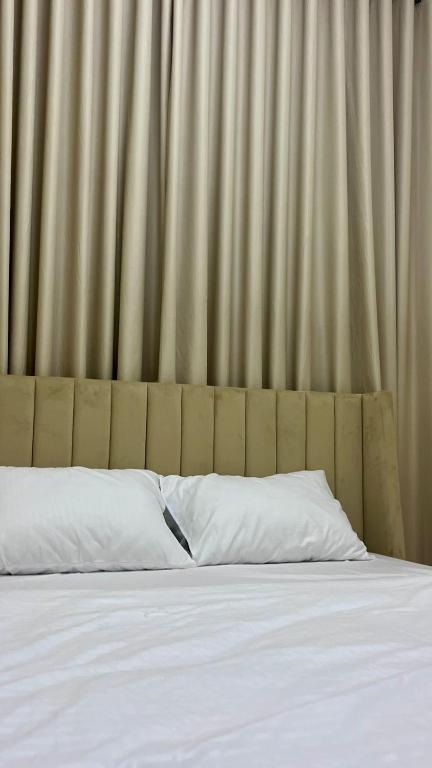 Postel nebo postele na pokoji v ubytování Sunset hotel