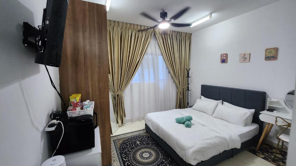 Postel nebo postele na pokoji v ubytování EnL Homestay ALANIS Residence