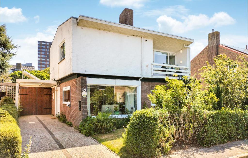 a brick house with a window and a garage at Stunning Apartment In Vlissingen in Vlissingen