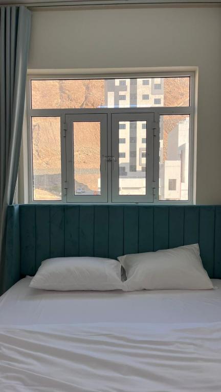 Postel nebo postele na pokoji v ubytování Sunset hotel