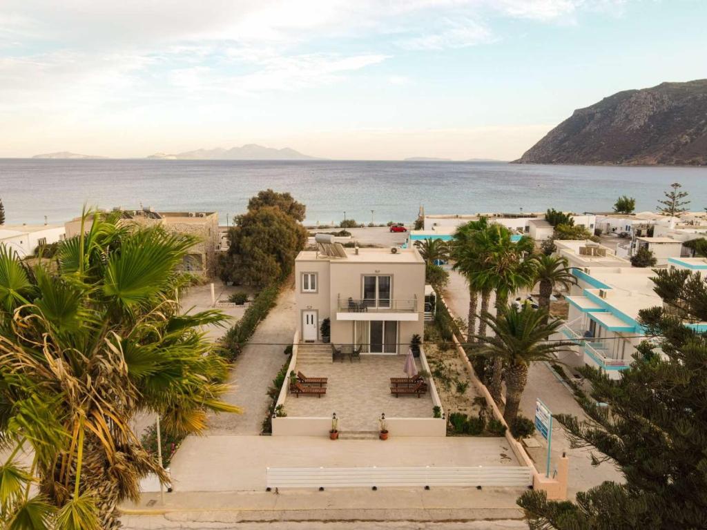 an aerial view of a white house and the ocean at Sunshine House Kos - Easy living by the sea in Kefalos