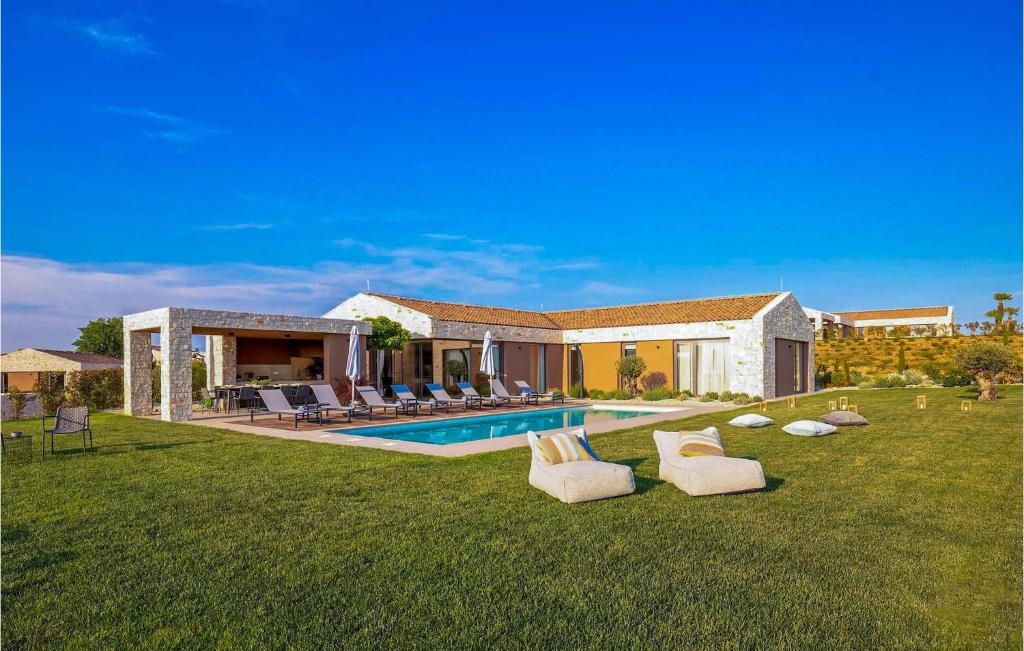 a house with a swimming pool in a yard at Villa Terra Bianca in Brtonigla