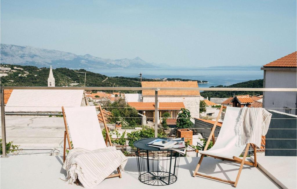 a pair of chairs on a balcony with a view at Villa Breakaway in Selca