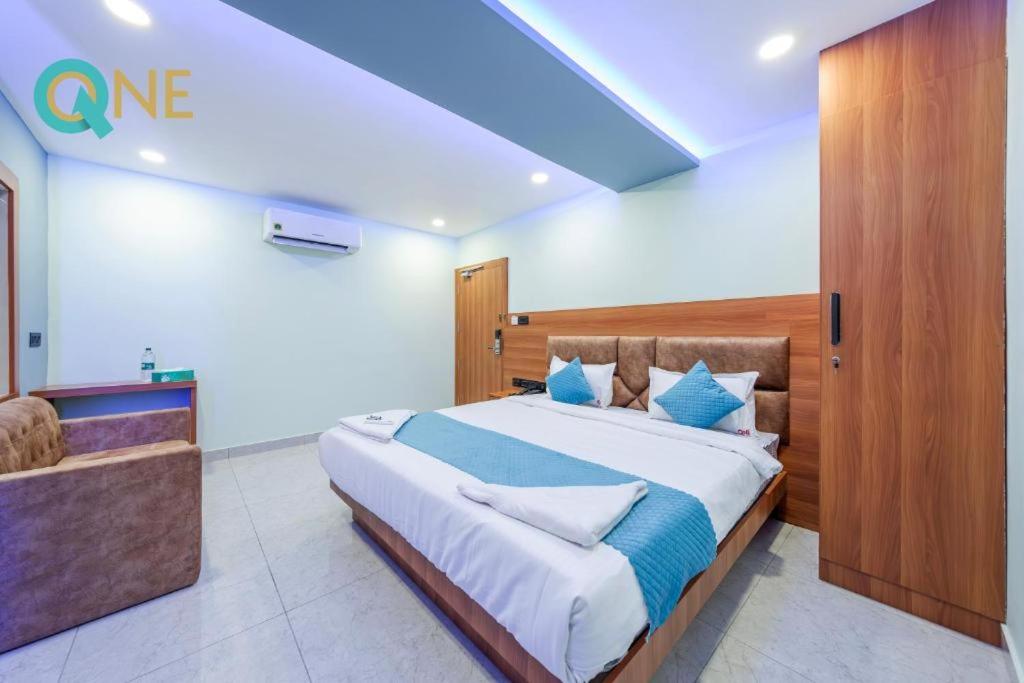 Postel nebo postele na pokoji v ubytování Glitz Hotels Q One - Nr Ernakulam Junction