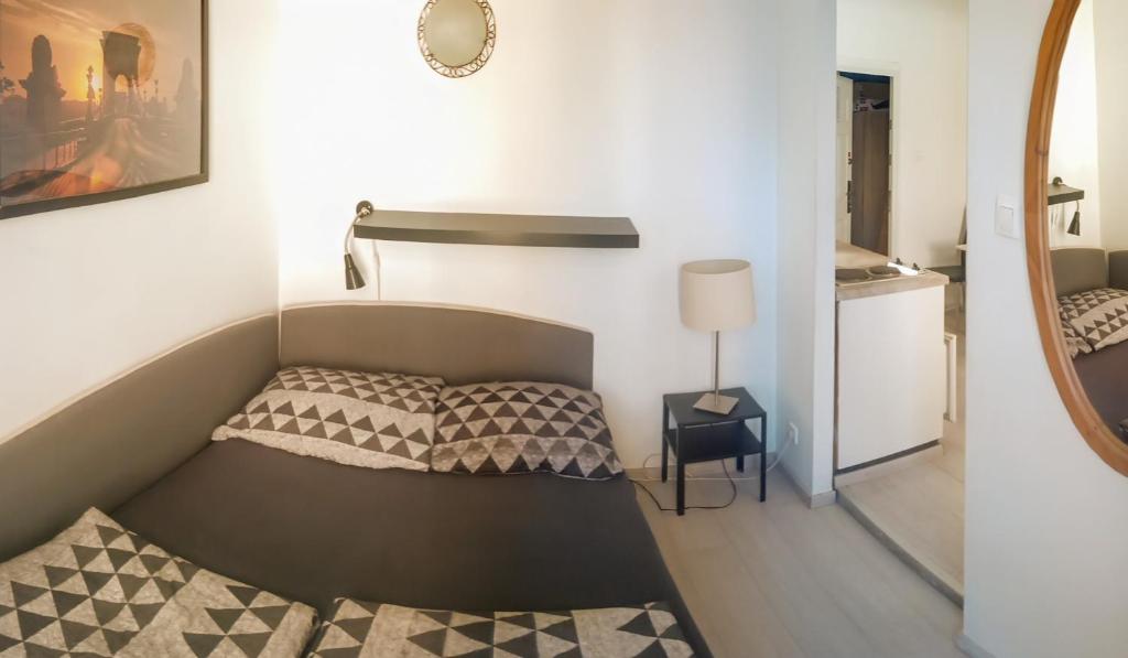 Posteľ alebo postele v izbe v ubytovaní SparrOwl Apartments