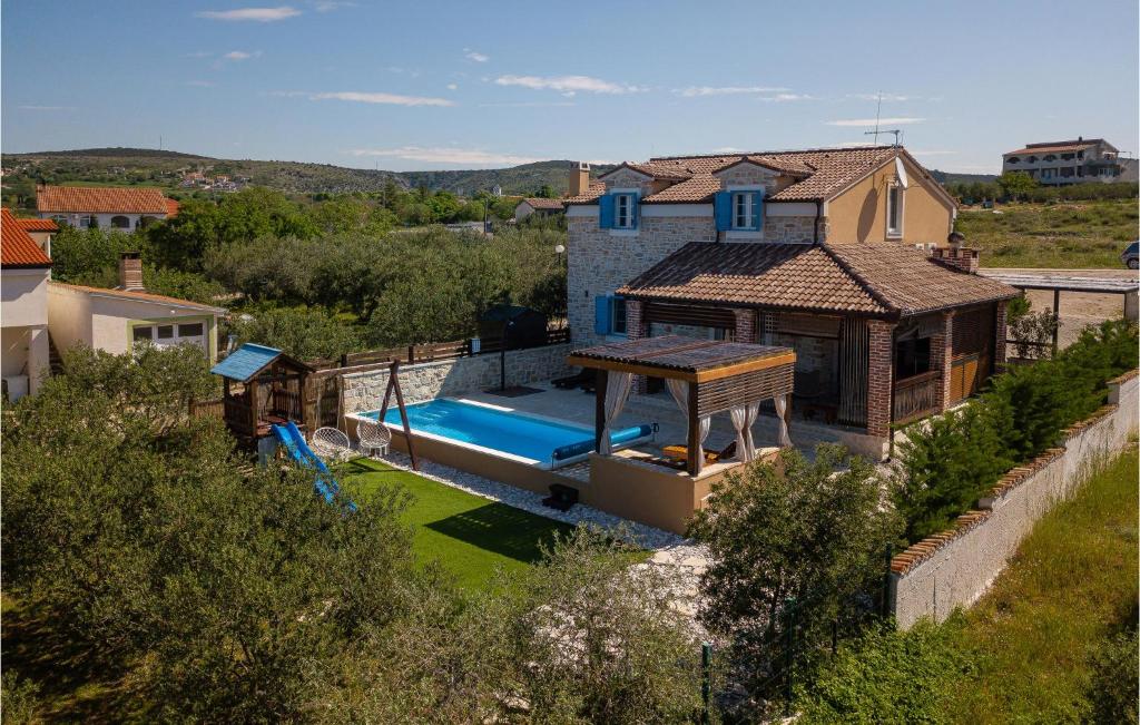 an aerial view of a house with a swimming pool at Villa Stella Del Lago in Vrana