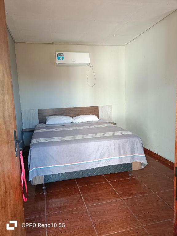 Ліжко або ліжка в номері Hospedaje San Juan del Paraná