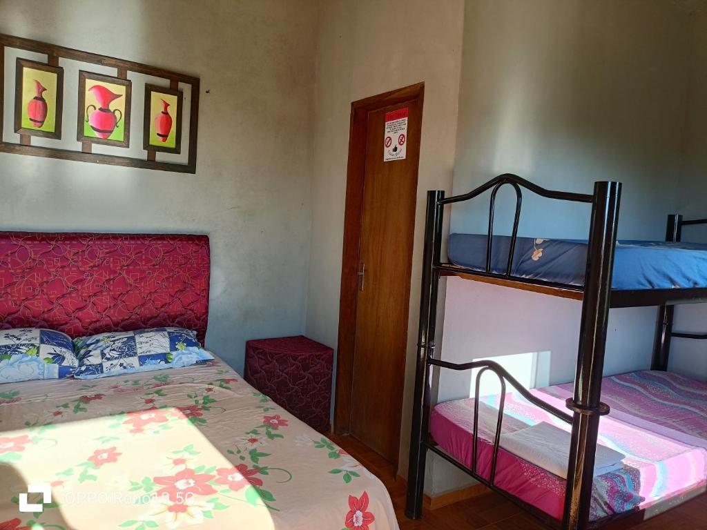 Ліжко або ліжка в номері Hospedaje San Juan del Paraná
