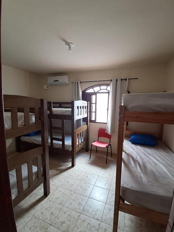 Voodi või voodid majutusasutuse Pontal Hostel Ilhéus toas