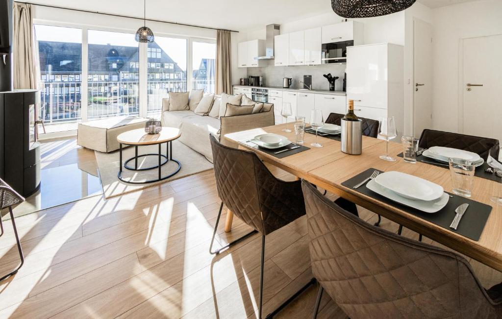 a kitchen and living room with a table and chairs at Gebirgsresort Winterberg in Winterberg