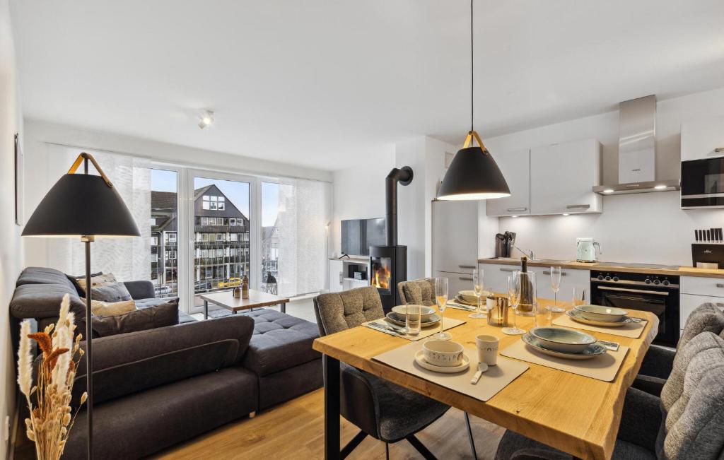 a kitchen and living room with a table and a couch at Gebirgsresort Winterberg in Winterberg