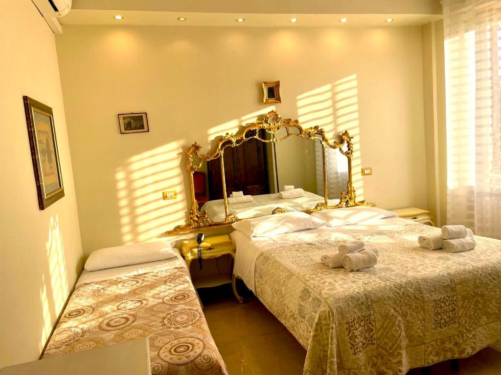 Posteľ alebo postele v izbe v ubytovaní Hotel Original