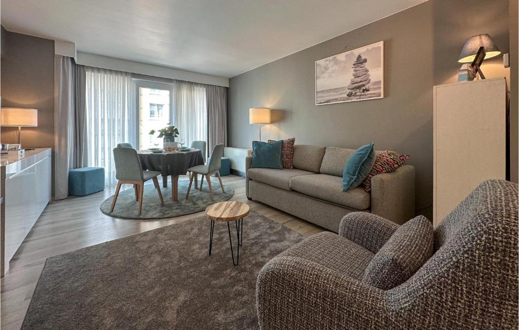 a living room with a couch and a table at 1 Bedroom Nice Apartment In Oostende in Ostend