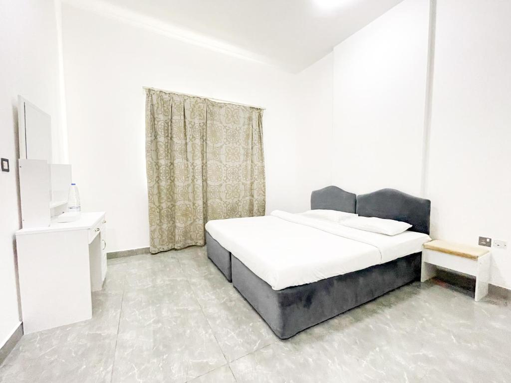 Postel nebo postele na pokoji v ubytování Warsan Star Residence - Home Stay