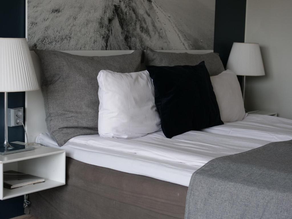 Ein Bett oder Betten in einem Zimmer der Unterkunft Clarion Hotel Sign