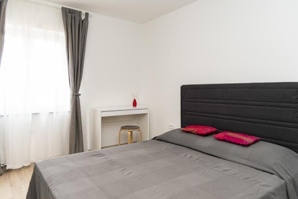 Posteľ alebo postele v izbe v ubytovaní Apartment Roma