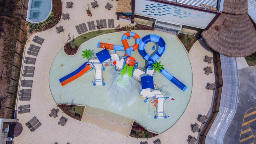 an aerial view of a water park with a water slide at Hotel Vilarejo Praia in Rio das Ostras