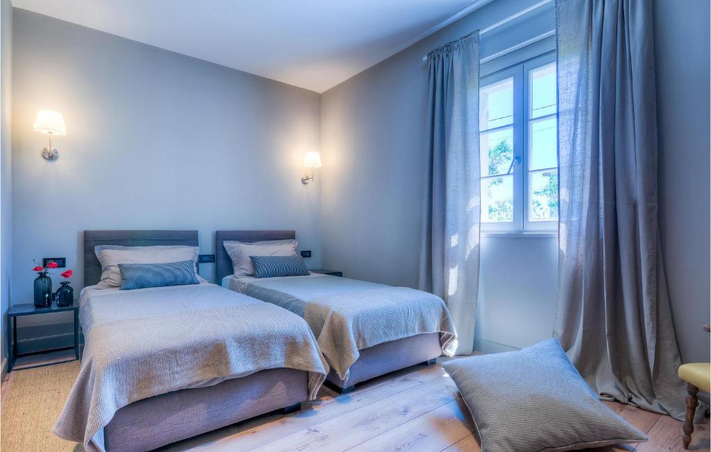 Postel nebo postele na pokoji v ubytování Villa Tena