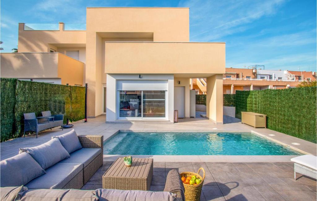 a swimming pool in the backyard of a house at Lovely Home In Cartagena With Kitchen in Cartagena