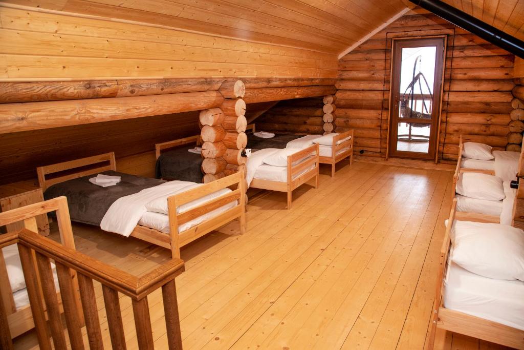 Postel nebo postele na pokoji v ubytování Ranger Campus Eco Lodge