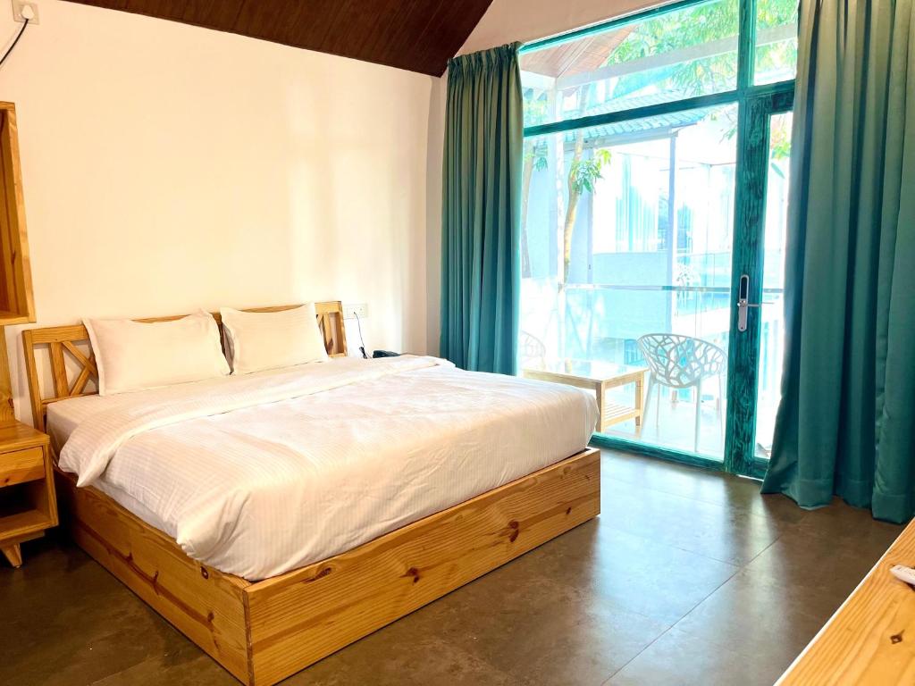Postel nebo postele na pokoji v ubytování Magic Sand Beach Resort
