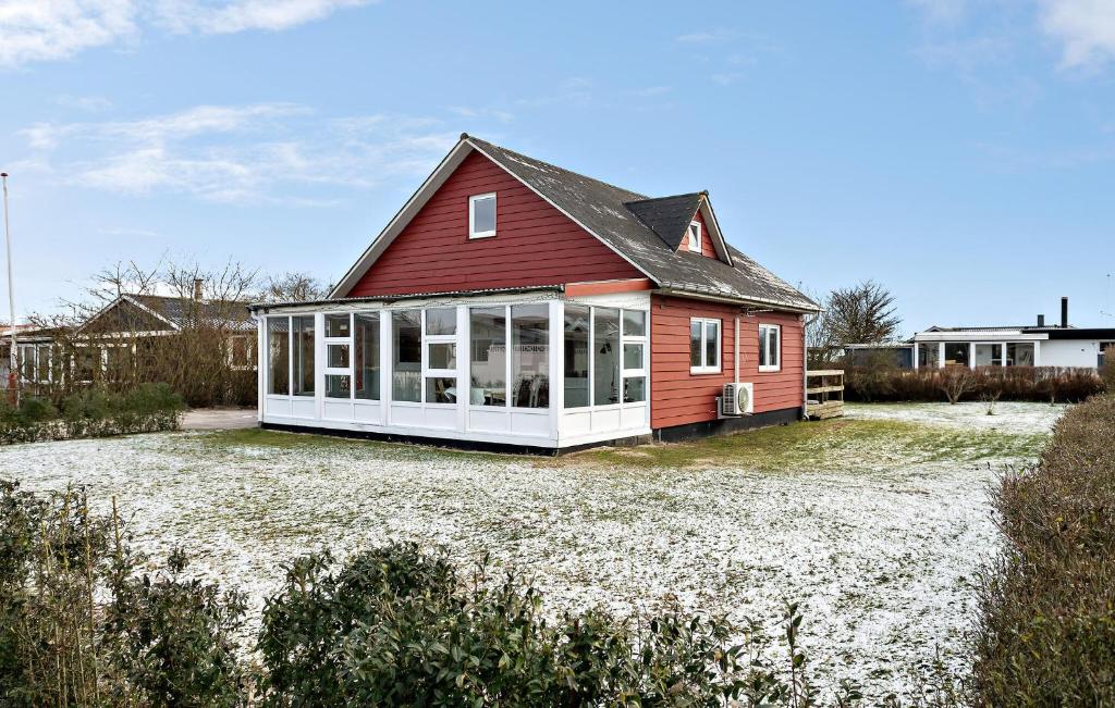 a house with a red roof on a yard at Amazing Home In Haderslev With Wifi in Haderslev