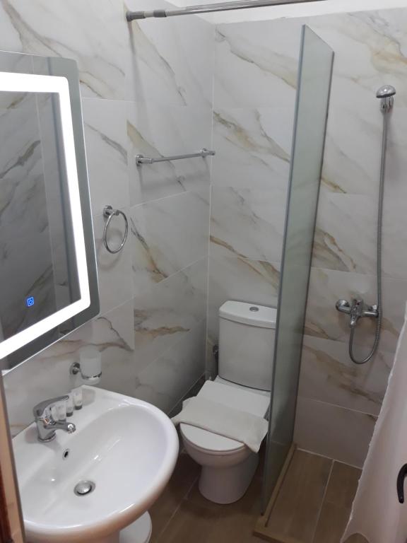 Koupelna v ubytování Qiqi Hotel