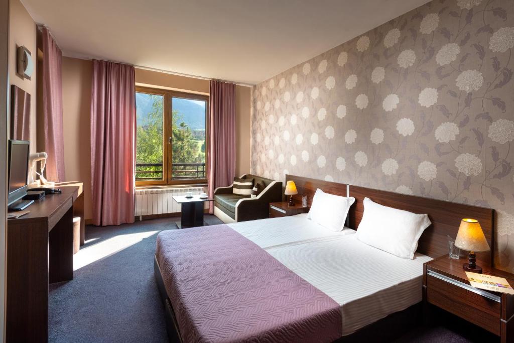Postel nebo postele na pokoji v ubytování Terra Hotel