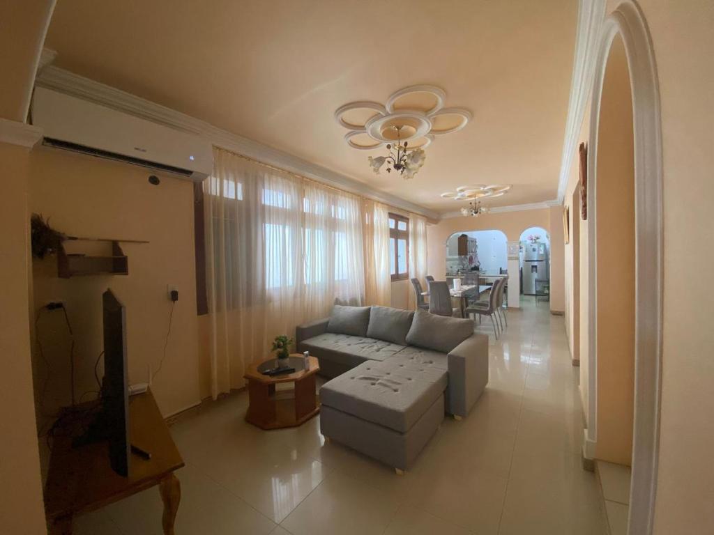 a living room with a couch and a table at Casa en centro salteño in Salta
