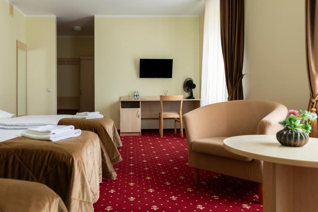 TV a/nebo společenská místnost v ubytování Domus Hotel