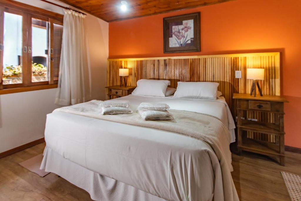 Postel nebo postele na pokoji v ubytování Hotel Ascona
