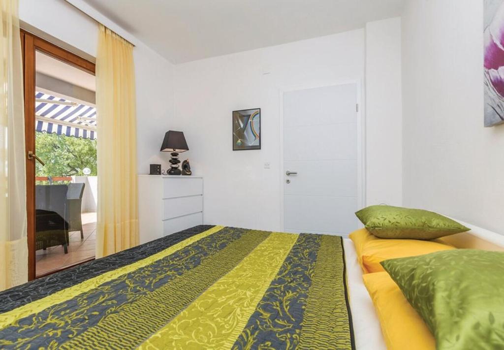 Posteľ alebo postele v izbe v ubytovaní Apartments Ivni