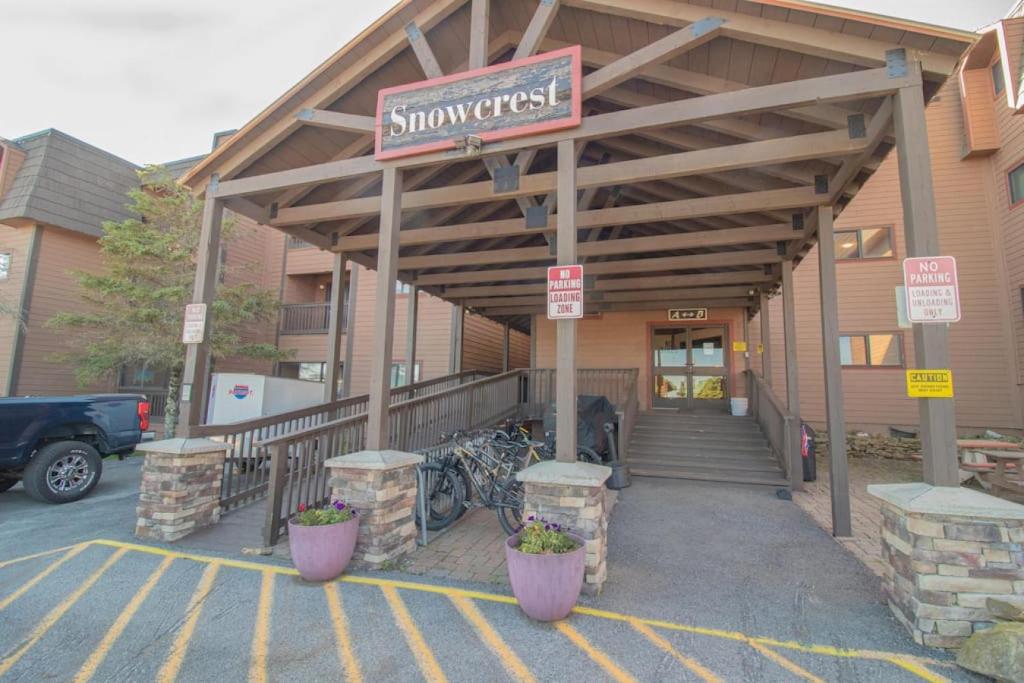 a building with a sign for a supermarket with bikes at SC105B 1BR 1BA Sleeps Six Wi-Fi Free Parking Close To Lift in Snowshoe