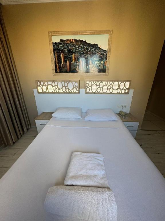 Postel nebo postele na pokoji v ubytování GRAND VATAN HOTEL