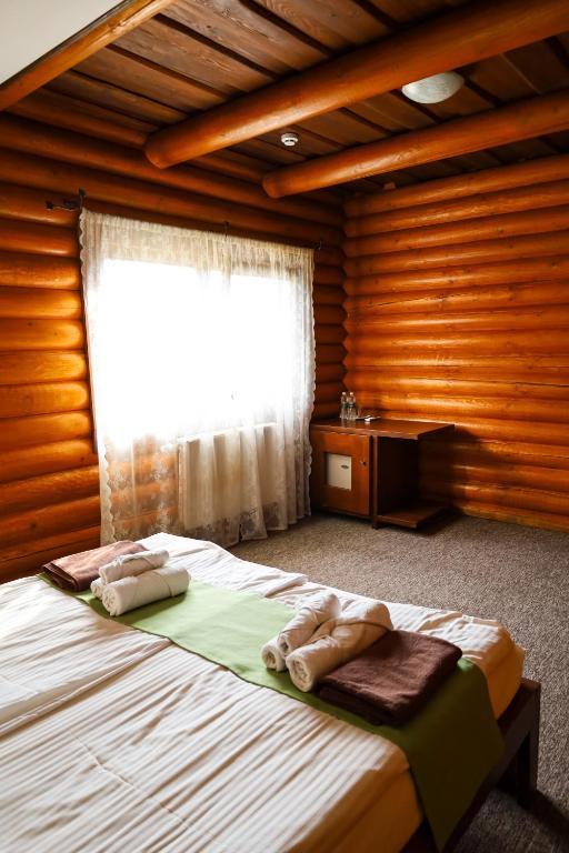 Postel nebo postele na pokoji v ubytování Recreation complex Volnogora