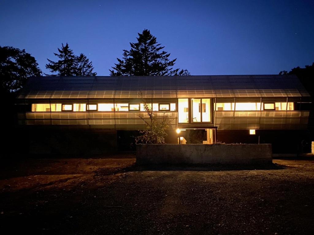 a building lit up at night with lights at Silent Cabin -dog friendly villa- in Nakagoya
