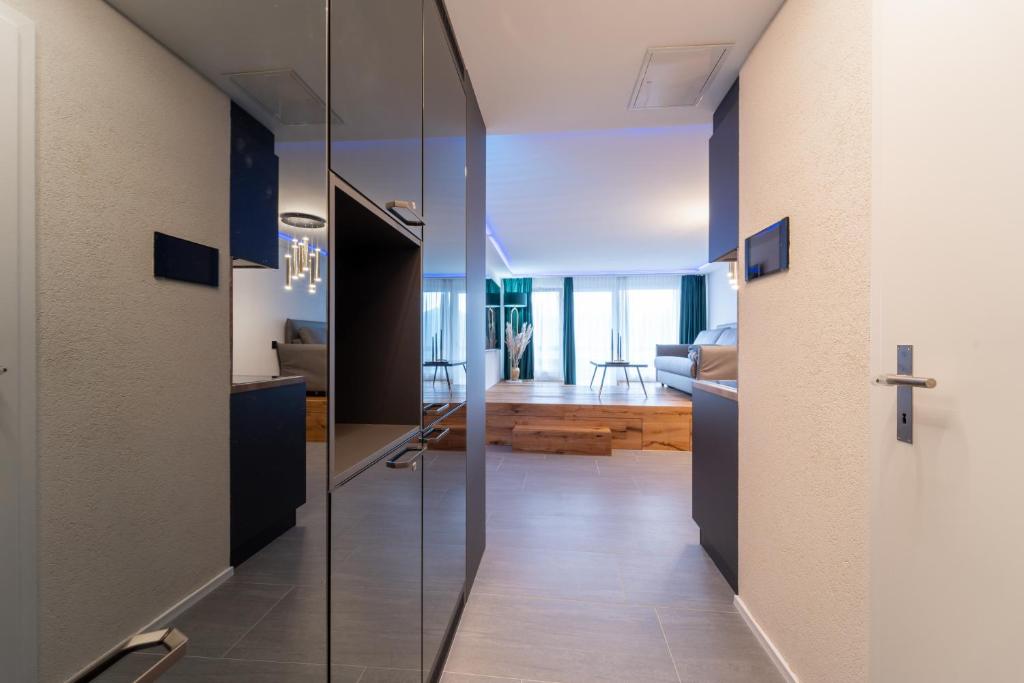 TV a/nebo společenská místnost v ubytování Traumwohnung in Interlaken inklusive SPA-Bereich