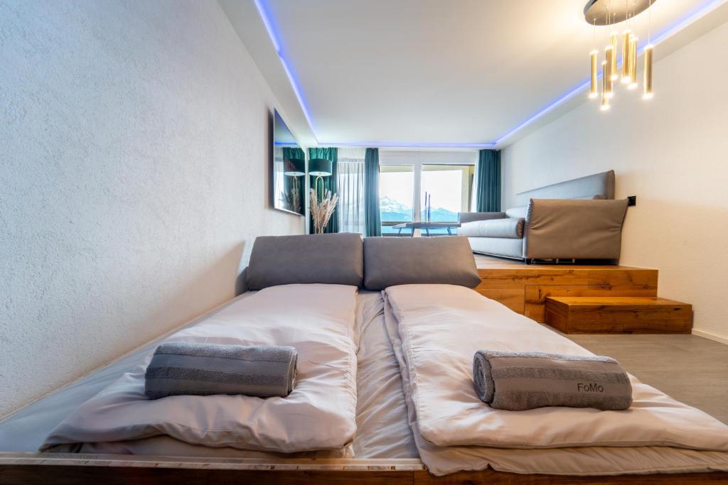 Postel nebo postele na pokoji v ubytování Traumwohnung in Interlaken inklusive SPA-Bereich