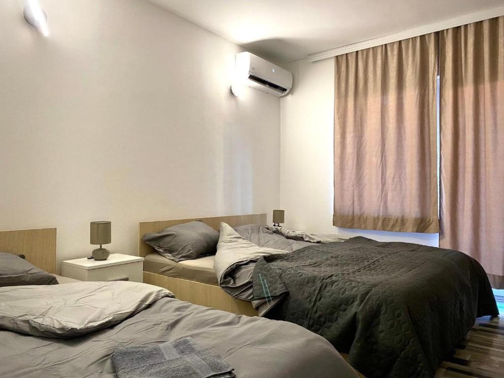 Postel nebo postele na pokoji v ubytování Studio Banjica