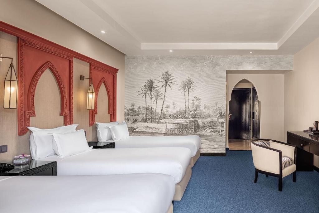 Postel nebo postele na pokoji v ubytování Grand Plaza Marrakech