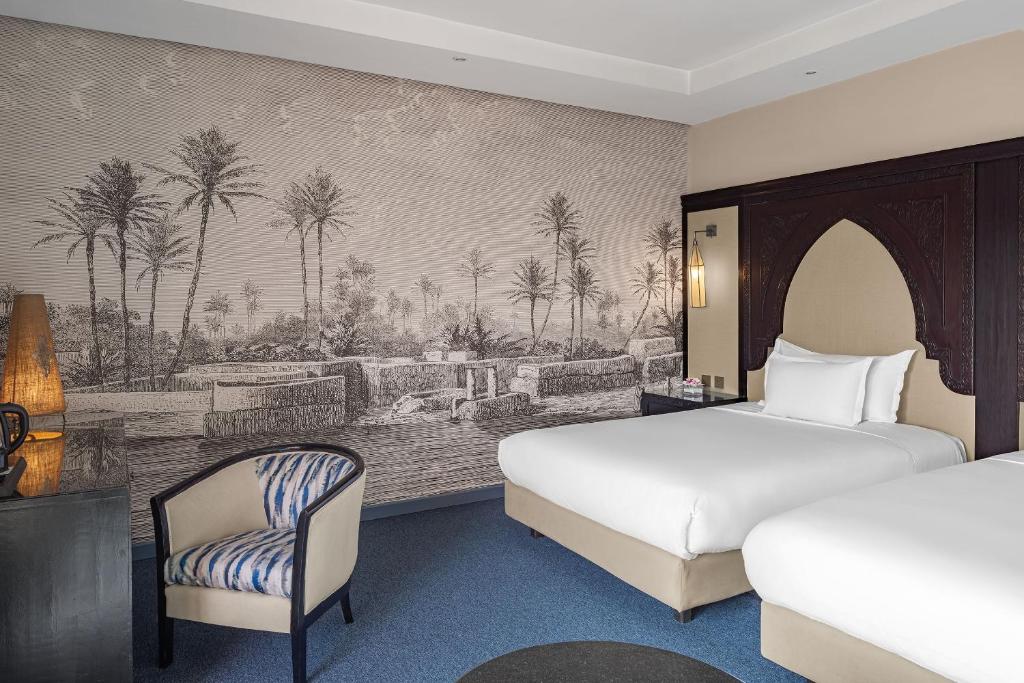 Postel nebo postele na pokoji v ubytování Grand Plaza Marrakech