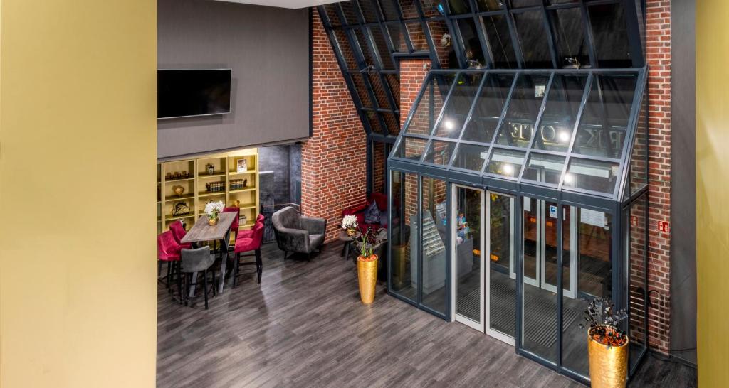 Posezení v ubytování PLAZA Premium Parkhotel Norderstedt