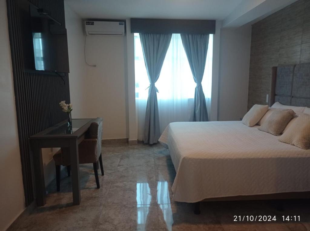 Postel nebo postele na pokoji v ubytování Hotel Presidente Internacional